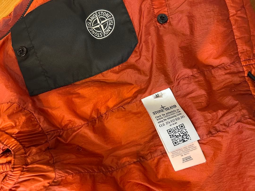 Stone  オレンジ ダウンベスト