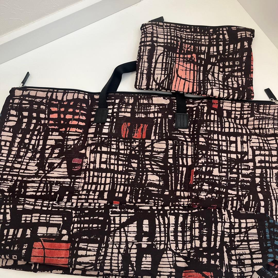 used・TUMI折畳みボストンバッグ・背にループ付き