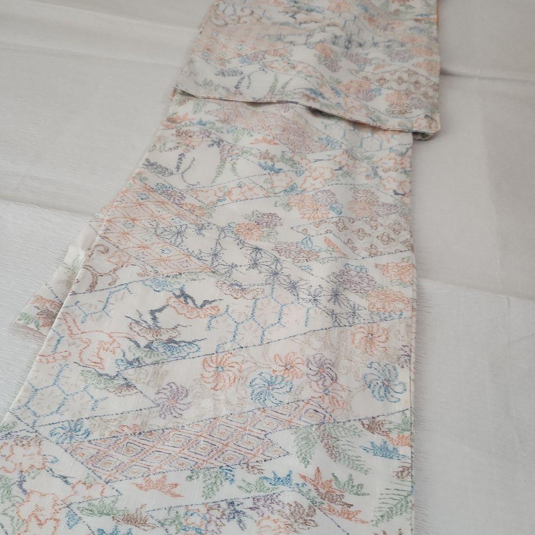 美品　縦節紬　やわらかな春色　松皮菱取吉祥四季花紋　真綿系