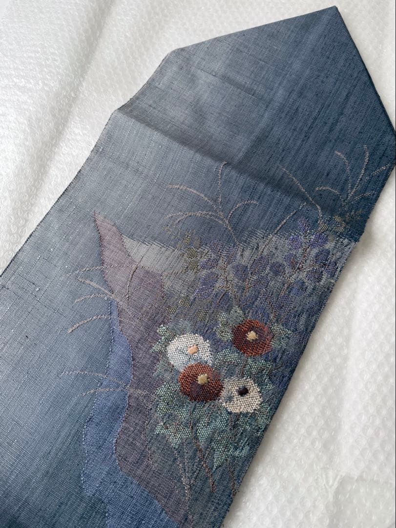 N34 美品 手織り真綿紬 万寿菊模様織出し 正絹 名古屋帯 ブルーグレー 暈し