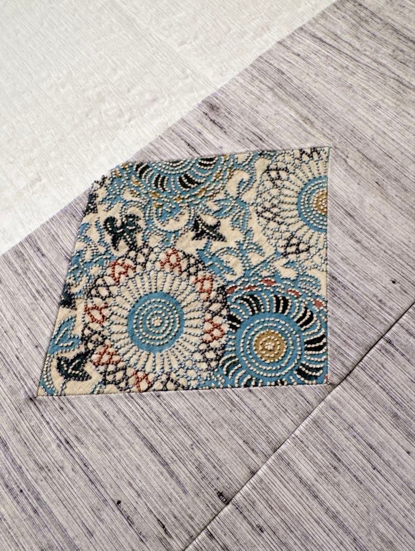 【未使用　お仕立て上り】　正絹　名古屋帯　紬地　型染めに相良刺繍　華唐草