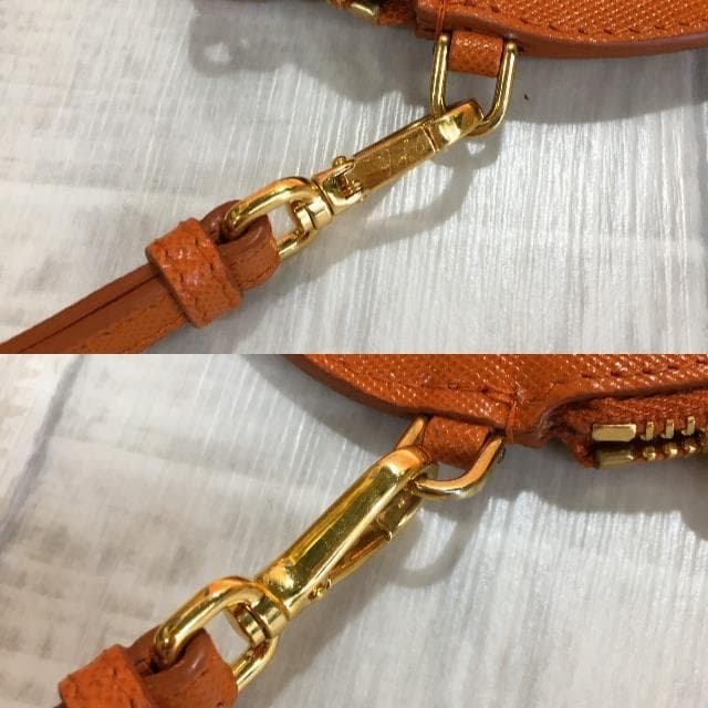 PRADA サフィアーノ ケース●オレンジ ラウンド 丸型 1M1443