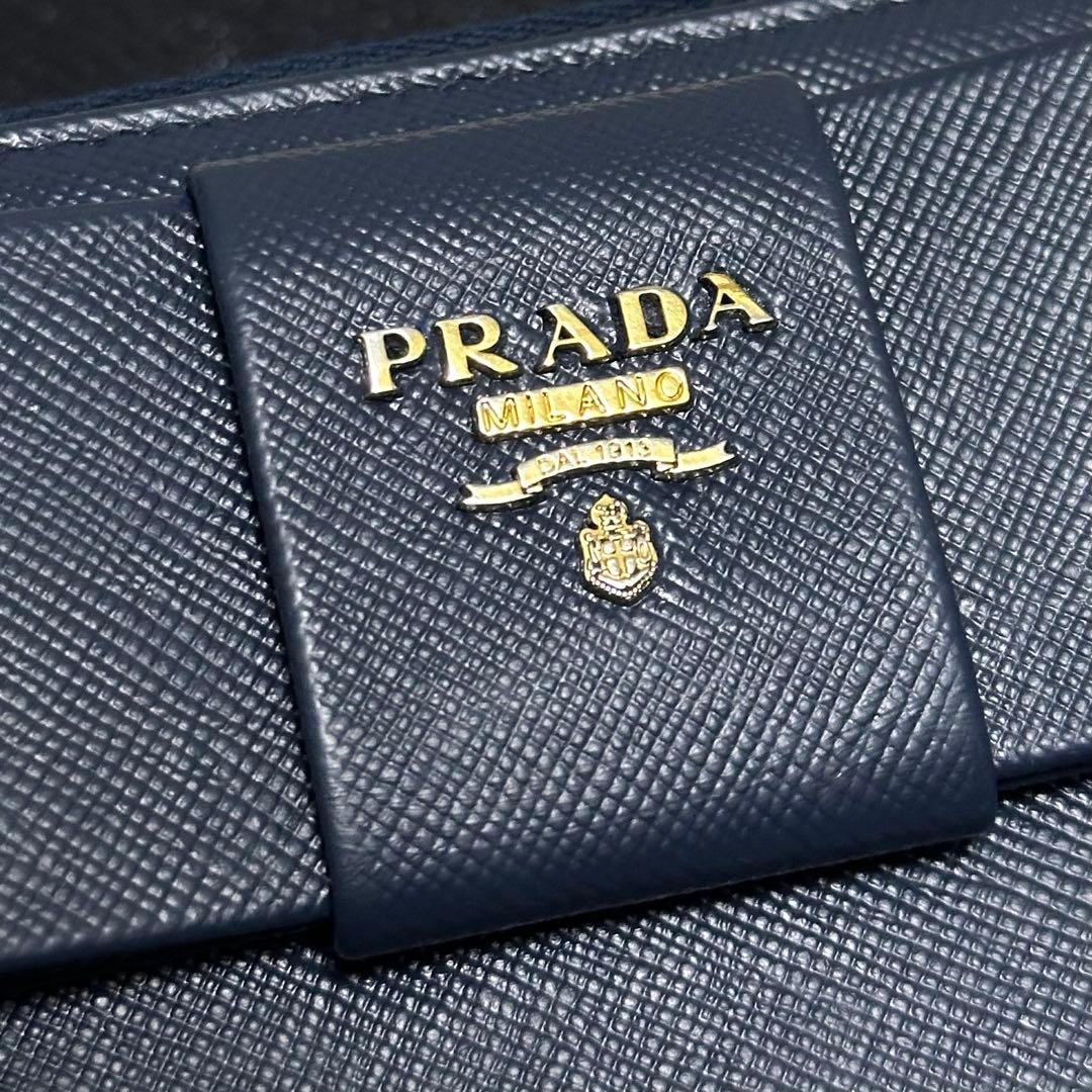 PRADA プラダ　長財布　リボン　ラウンドファスナー　ブルー　ゴールドロゴ