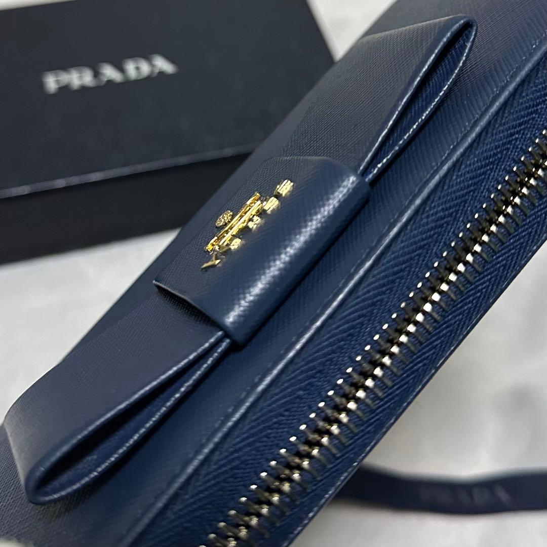 PRADA プラダ　長財布　リボン　ラウンドファスナー　ブルー　ゴールドロゴ