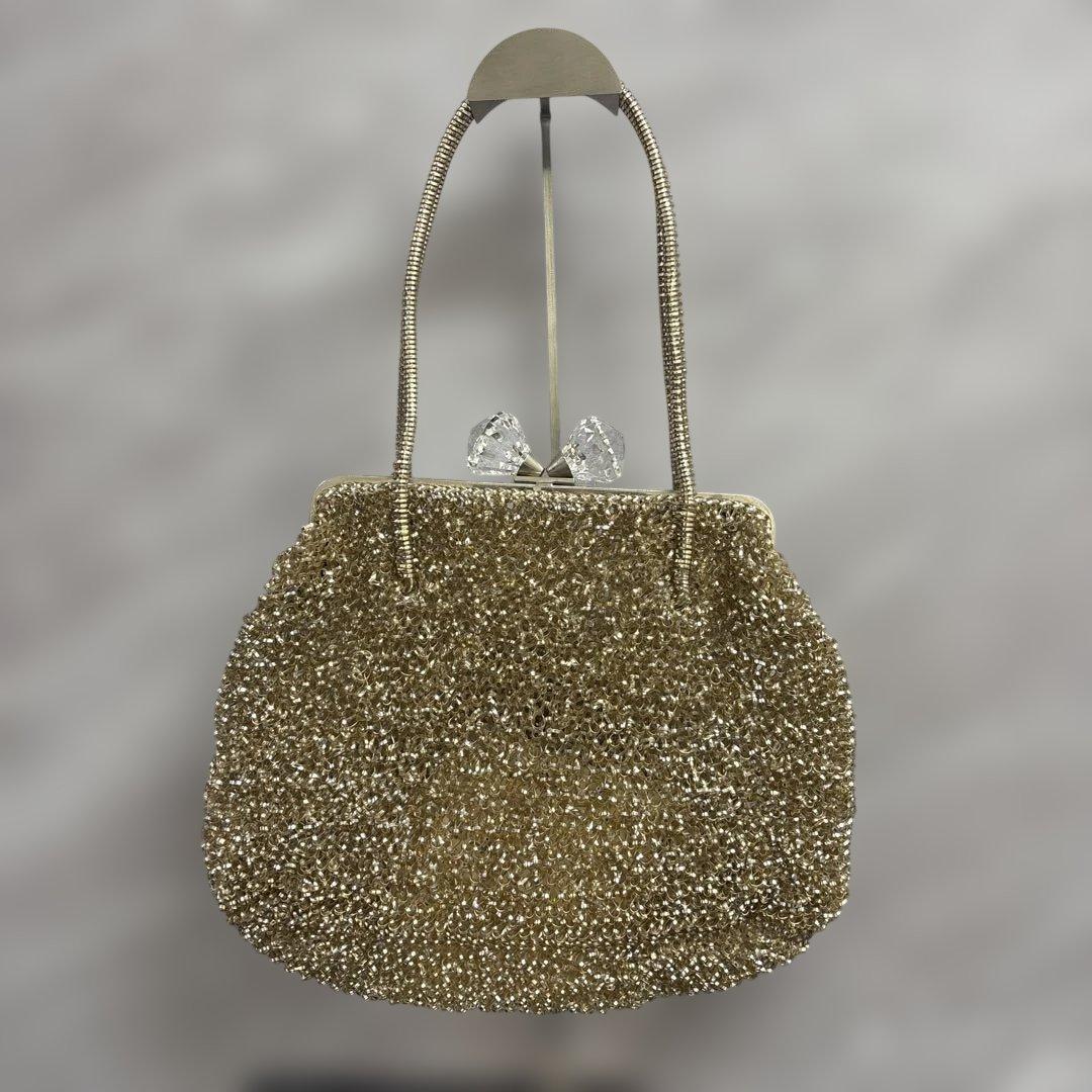 アンテプリマ　ワイヤーハンドバッグ　がま口　リボン　ゴールド