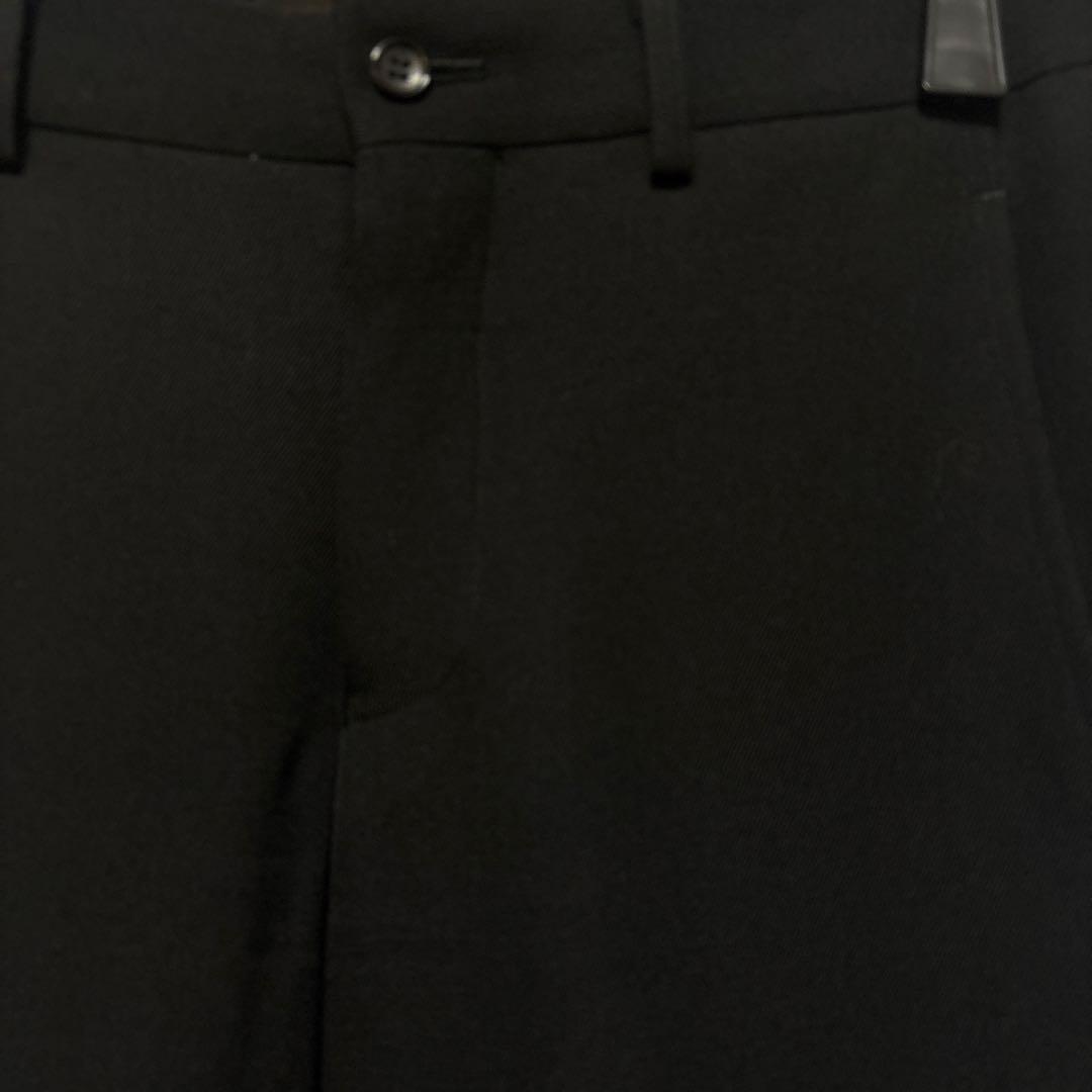 コムデギャルソンオムプリュス 螺旋ジッパーデザインの黒スラックス