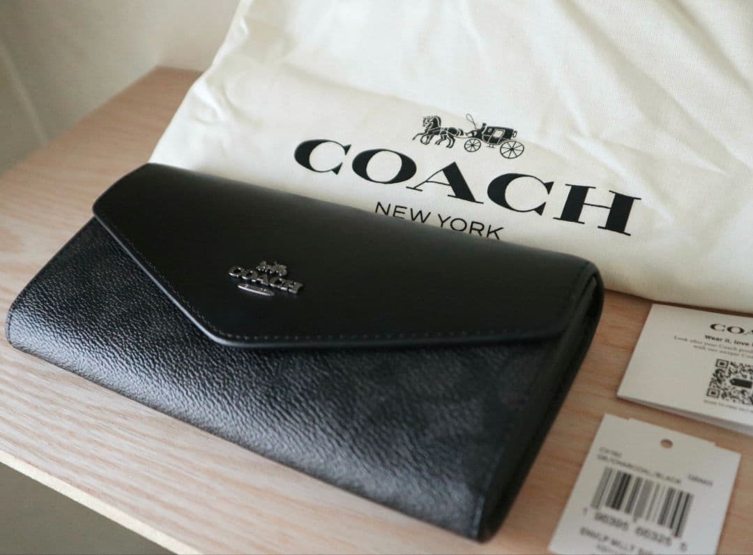 新品コーチ COACH 長財布　エンベロープ ウォレットシグネチャー キャンバス
