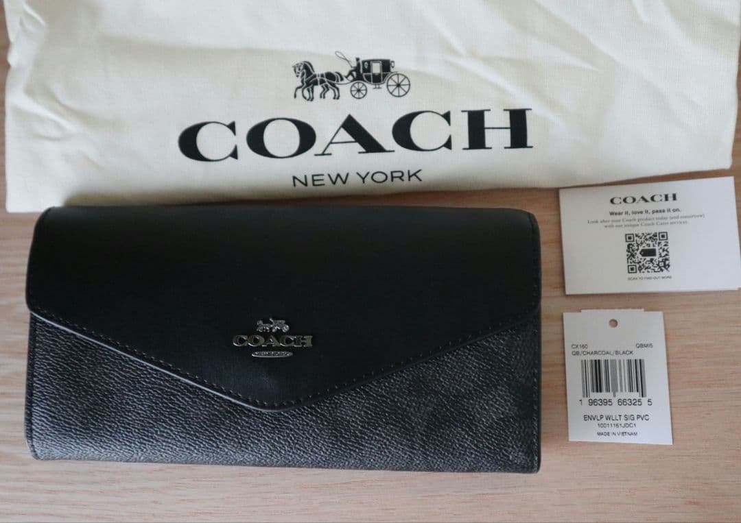 新品コーチ COACH 長財布　エンベロープ ウォレットシグネチャー キャンバス
