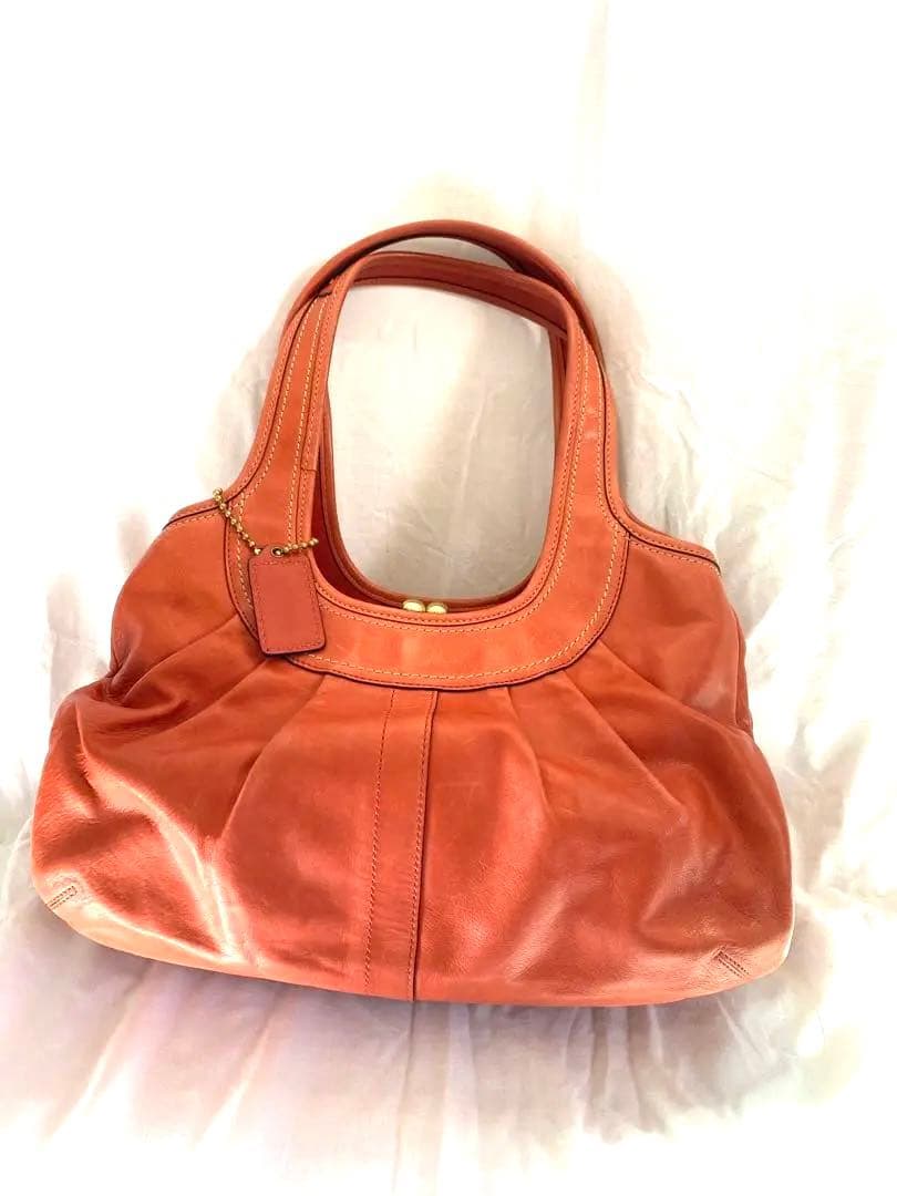 コーチ　オレンジ　エルゴレザープリーテッドフレームドサッチェル