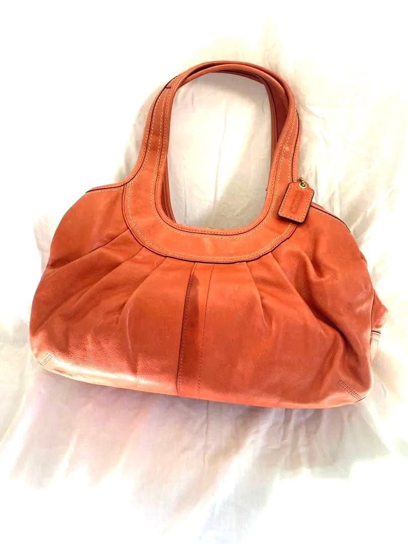 コーチ　オレンジ　エルゴレザープリーテッドフレームドサッチェル