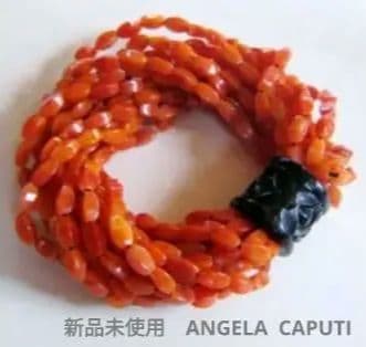 新品未使用　ANGELA CAPUTI の14連のゴムバングル　オレンジ