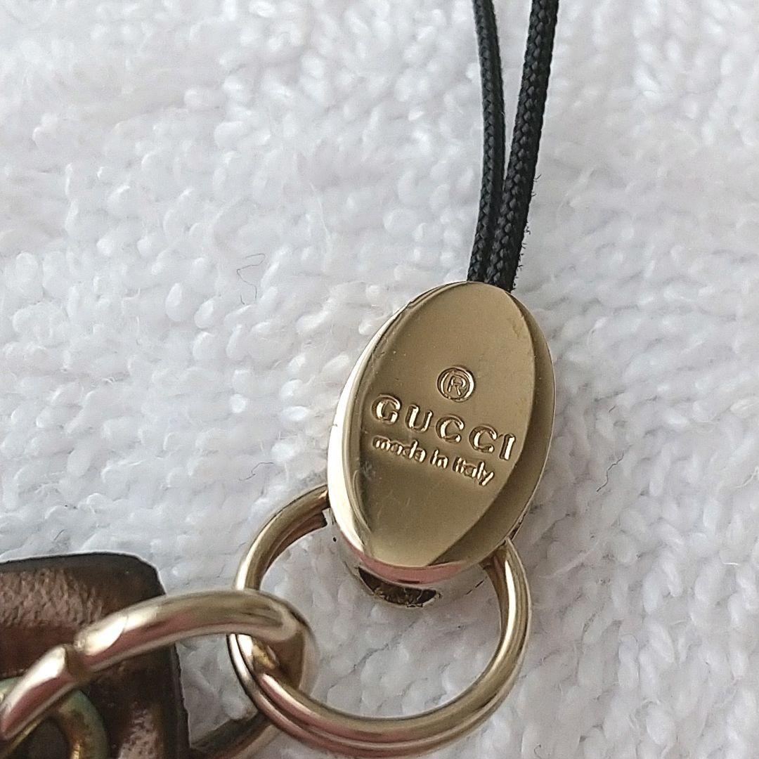 【新品 】 グッチ ストラップ GUCCI 筆記体ロゴ レザー 廃盤 ゴールド