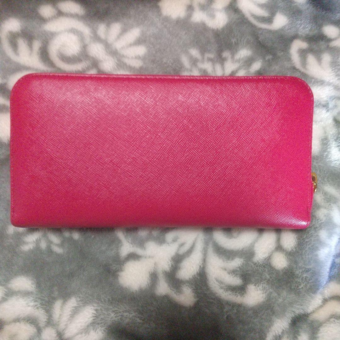 PRADA サフィアーノラウンドファスナーリボン付き長財布 レッド系