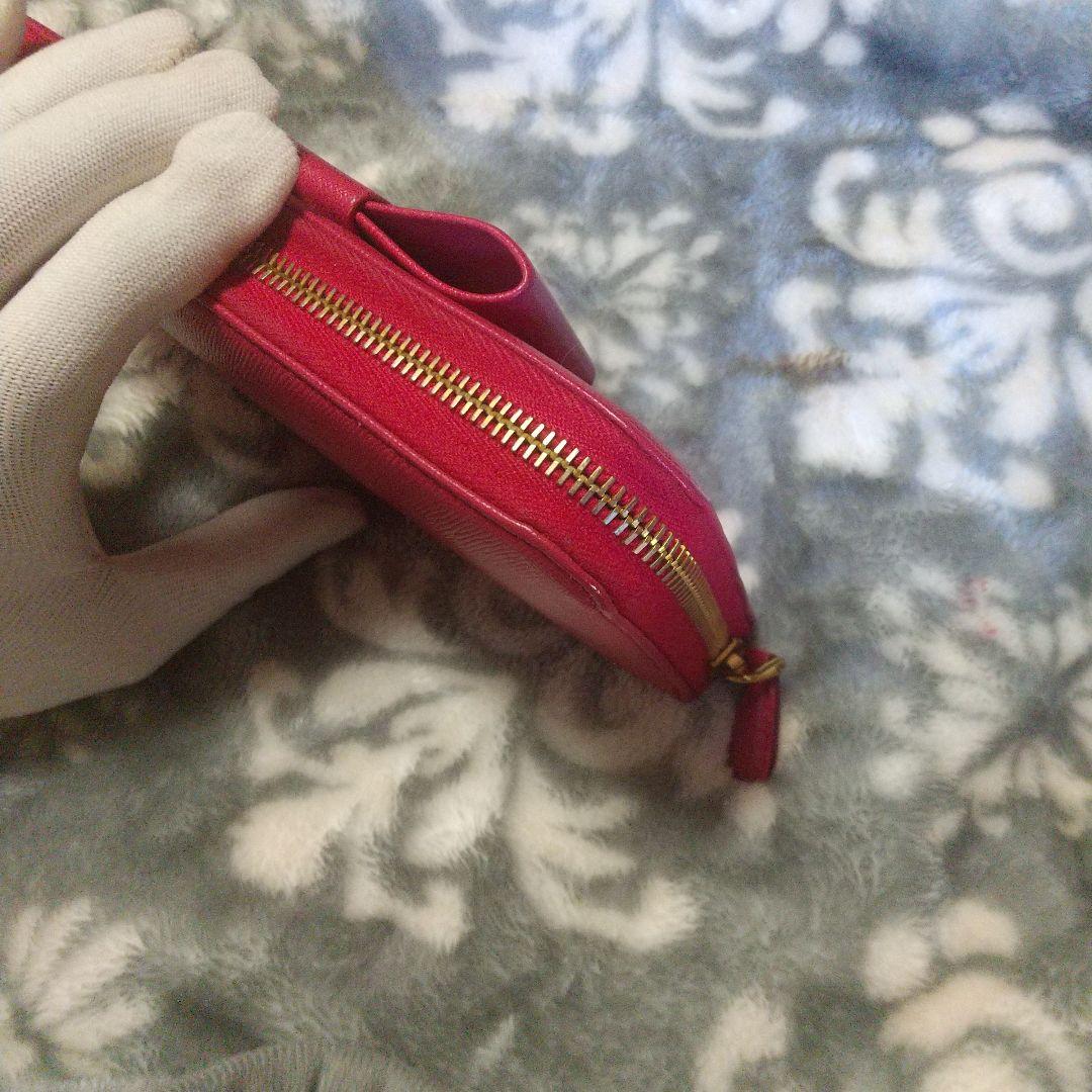 PRADA サフィアーノラウンドファスナーリボン付き長財布 レッド系