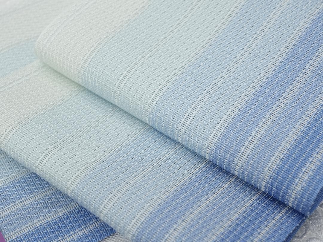 新品 博多織 夏物 単衣半幅帯 西村織物【粗紗】総暈しブルー 帯端処理加工込み