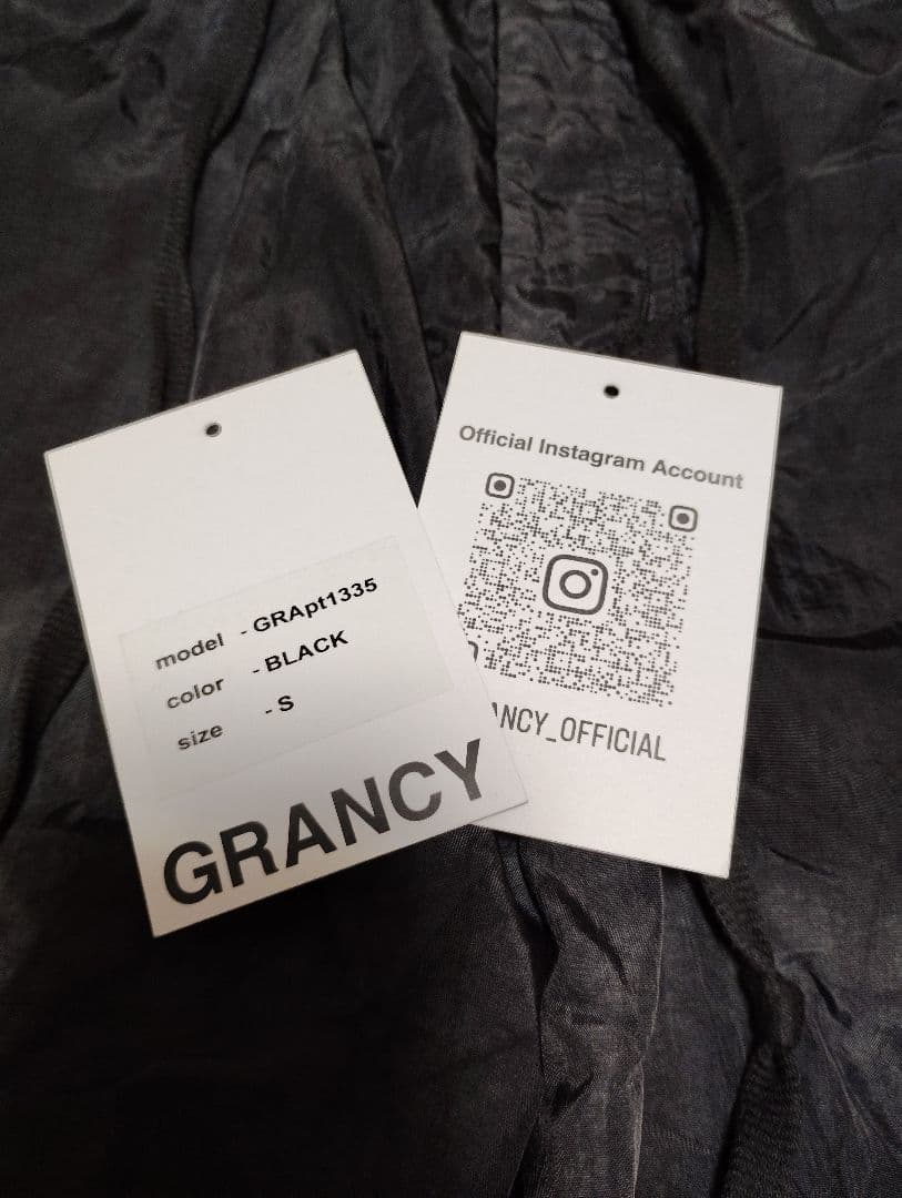 grancy ボタンレイヤードデザインナイロンパンツ