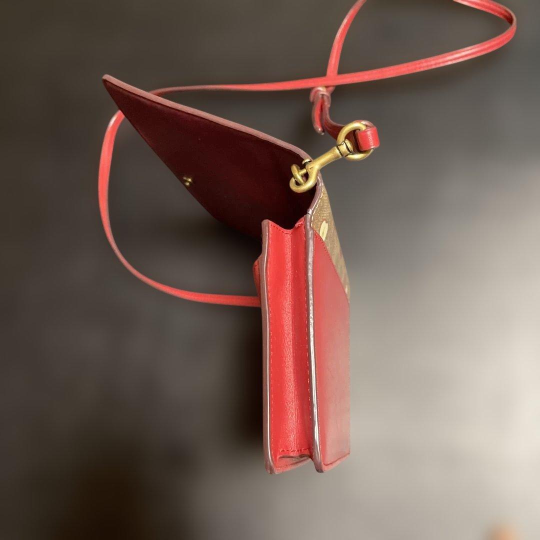 ゆずお値下げCOACH リンゴ柄 クラッチバッグ