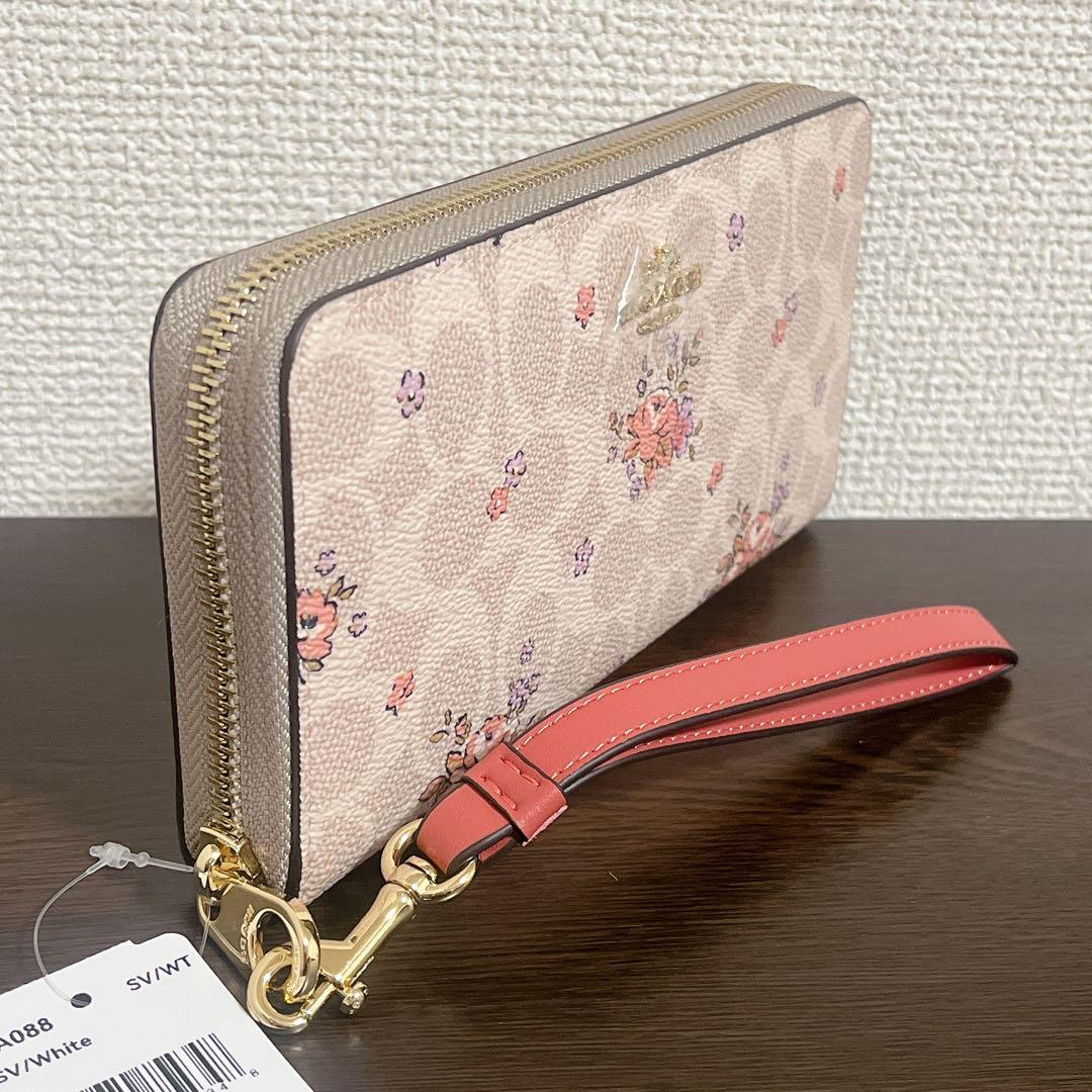 コーチ　 長財布　ベージュ　ストラップ付　花柄　シグネチャー　ラウンドファスナー
