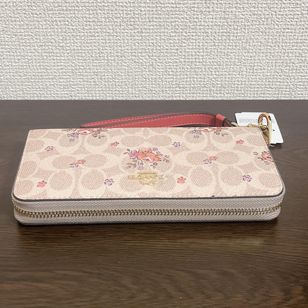 コーチ　 長財布　ベージュ　ストラップ付　花柄　シグネチャー　ラウンドファスナー