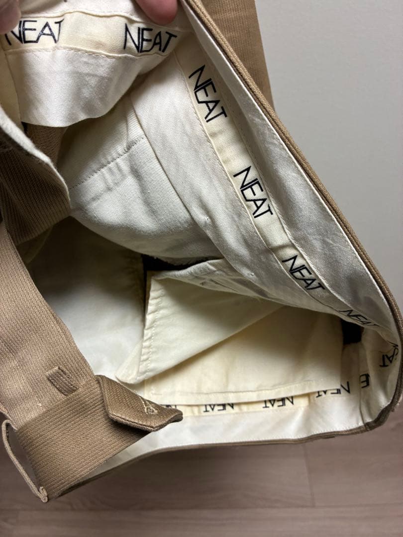 パンツ NEAT COTTON PIQUE TAPERED PANTS