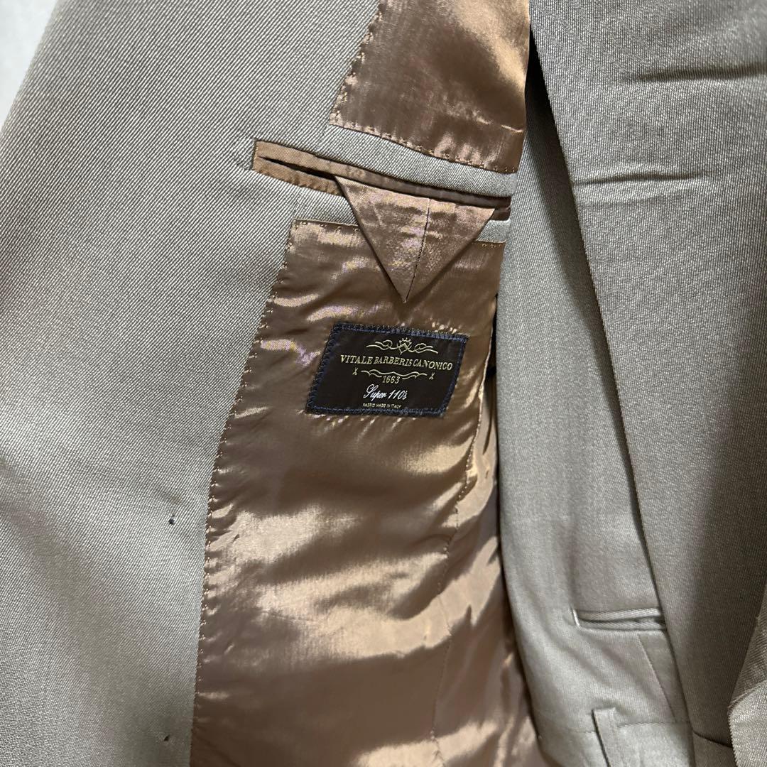 ユニバーサルランゲージ　カノニコカバード　ベージュダブルスーツ