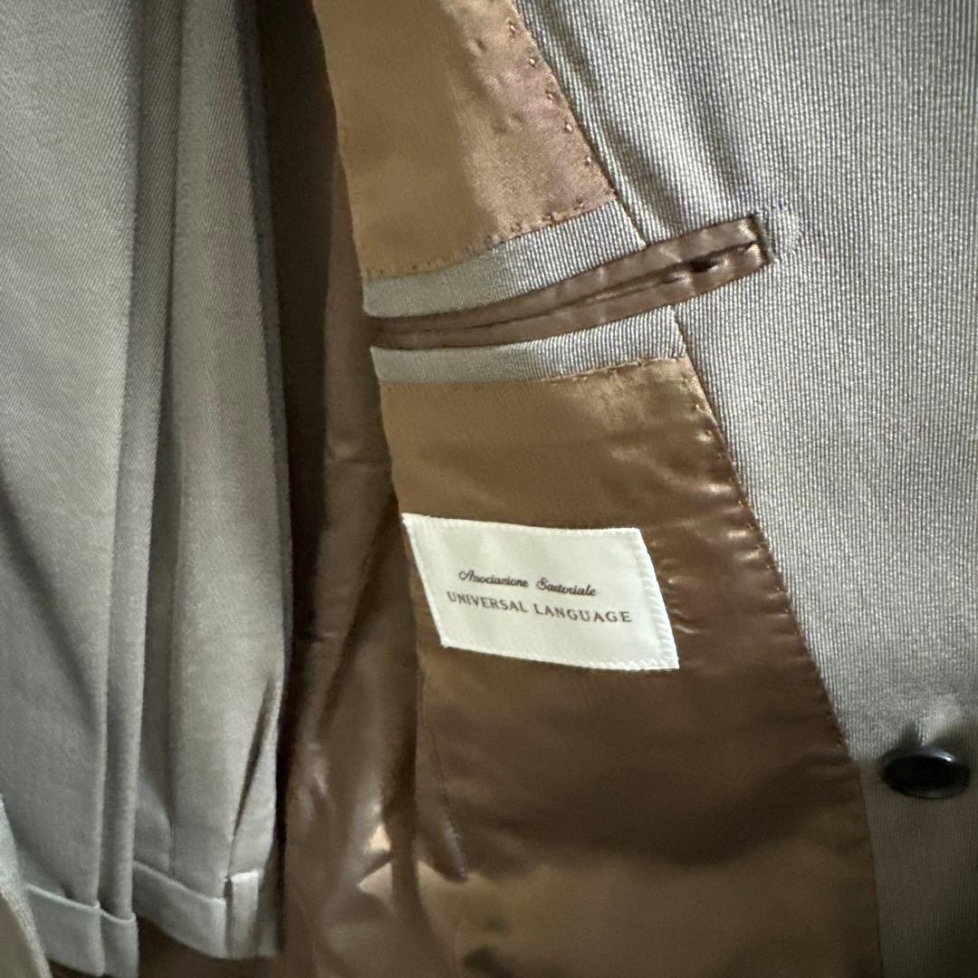 ユニバーサルランゲージ　カノニコカバード　ベージュダブルスーツ
