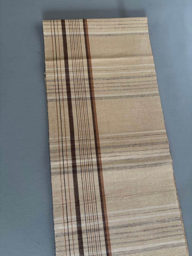 〈お楽しみ価格〉正絹 真綿紬 八寸名古屋帯 薄辛子ベージュ 変わり格子絣