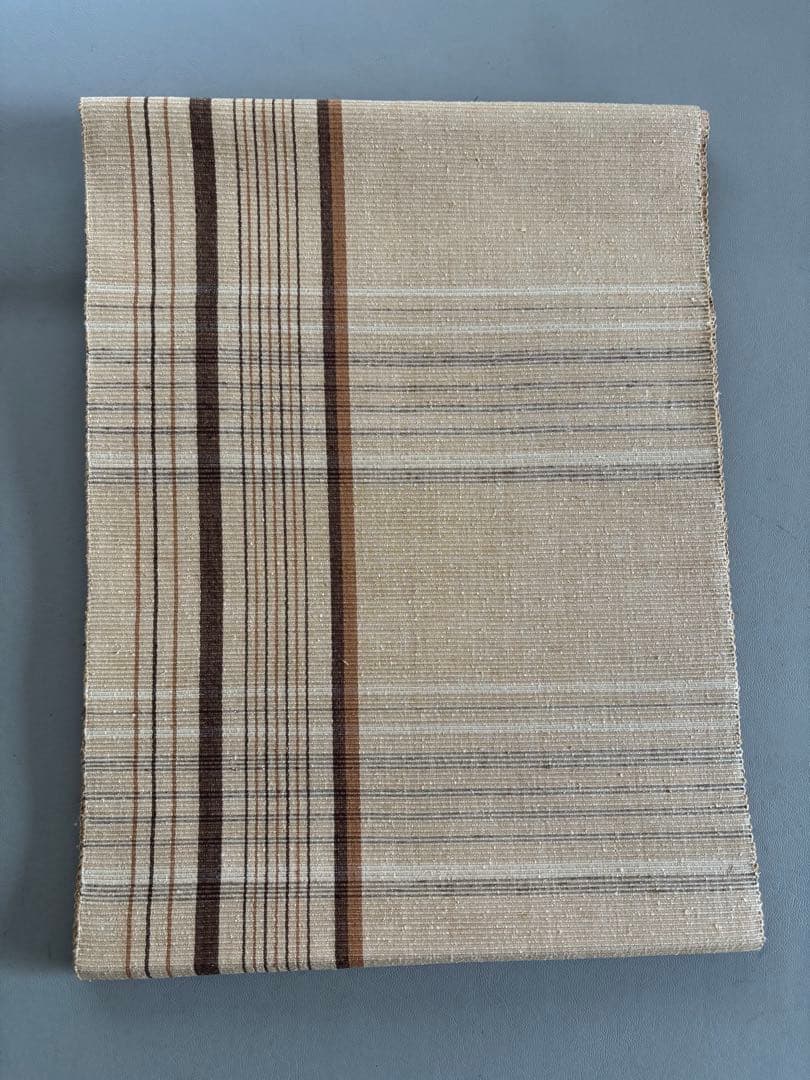 〈お楽しみ価格〉正絹 真綿紬 八寸名古屋帯 薄辛子ベージュ 変わり格子絣