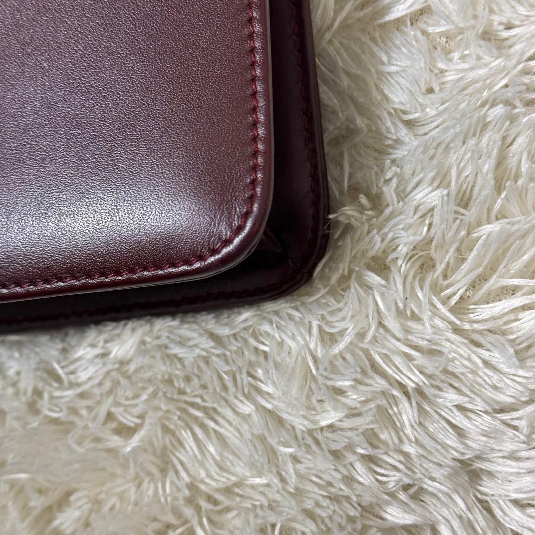 カルティエ　マストライン　クラッチバッグ　ボルドー　ロゴ金具