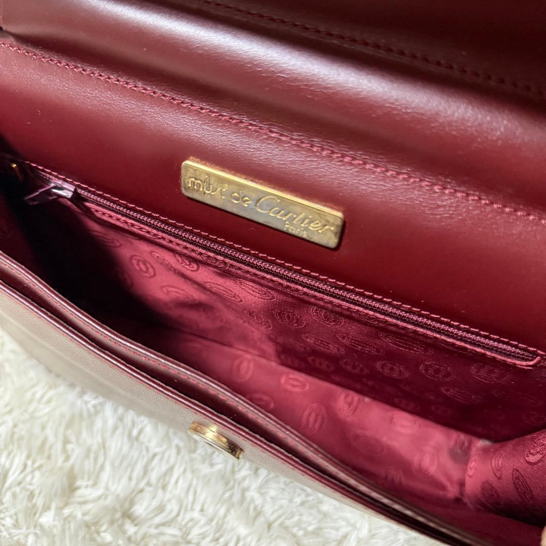 カルティエ　マストライン　クラッチバッグ　ボルドー　ロゴ金具