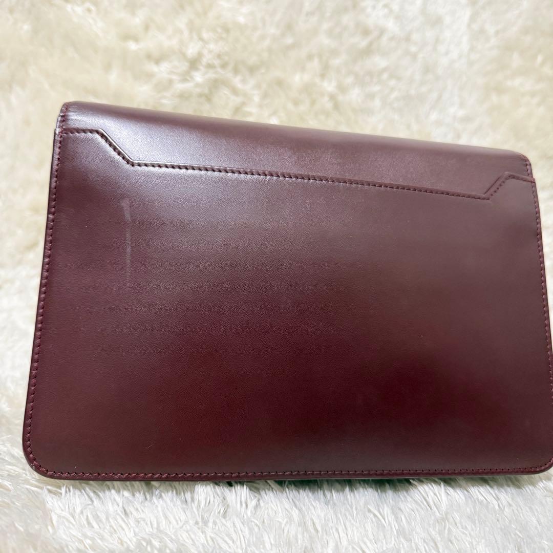 カルティエ　マストライン　クラッチバッグ　ボルドー　ロゴ金具