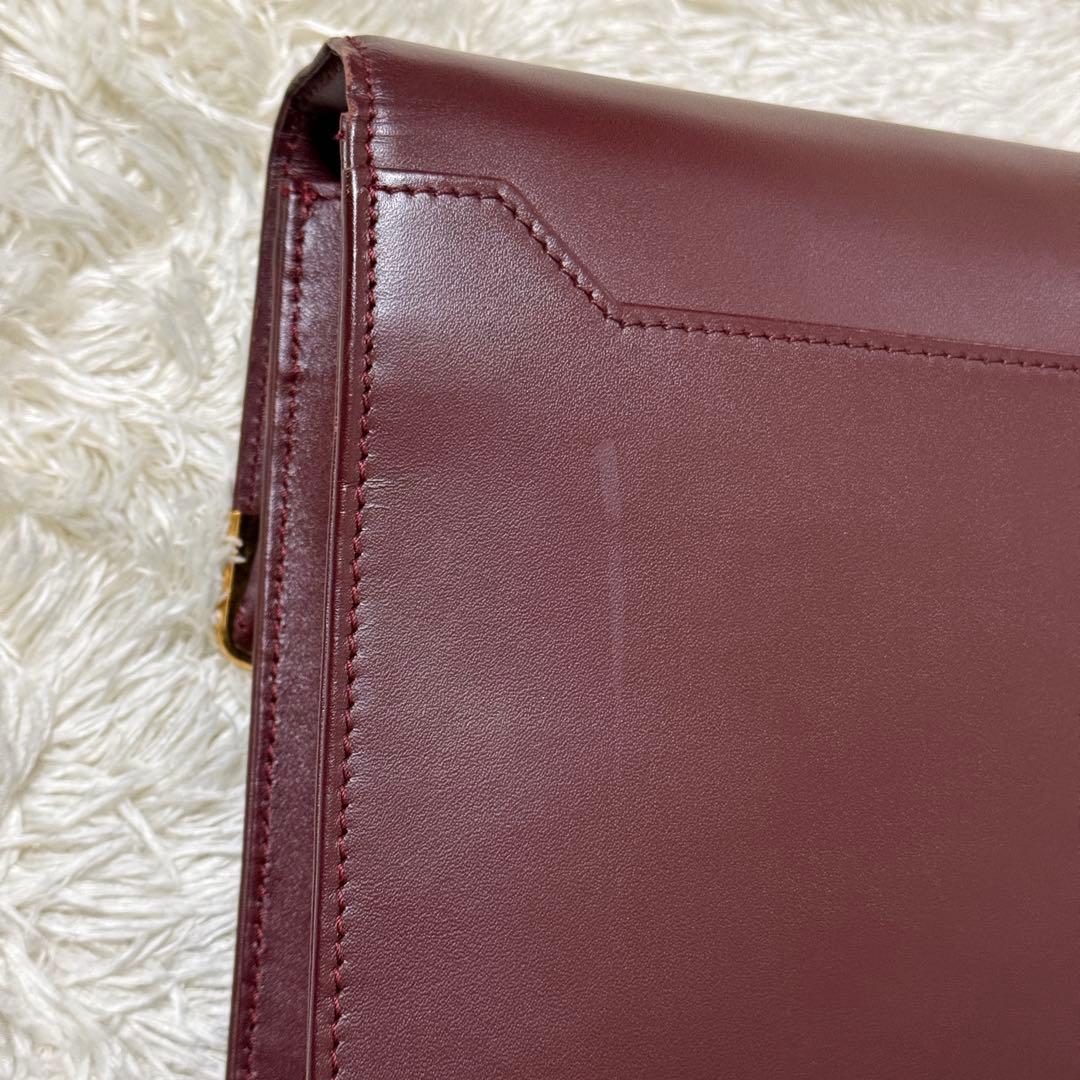 カルティエ　マストライン　クラッチバッグ　ボルドー　ロゴ金具