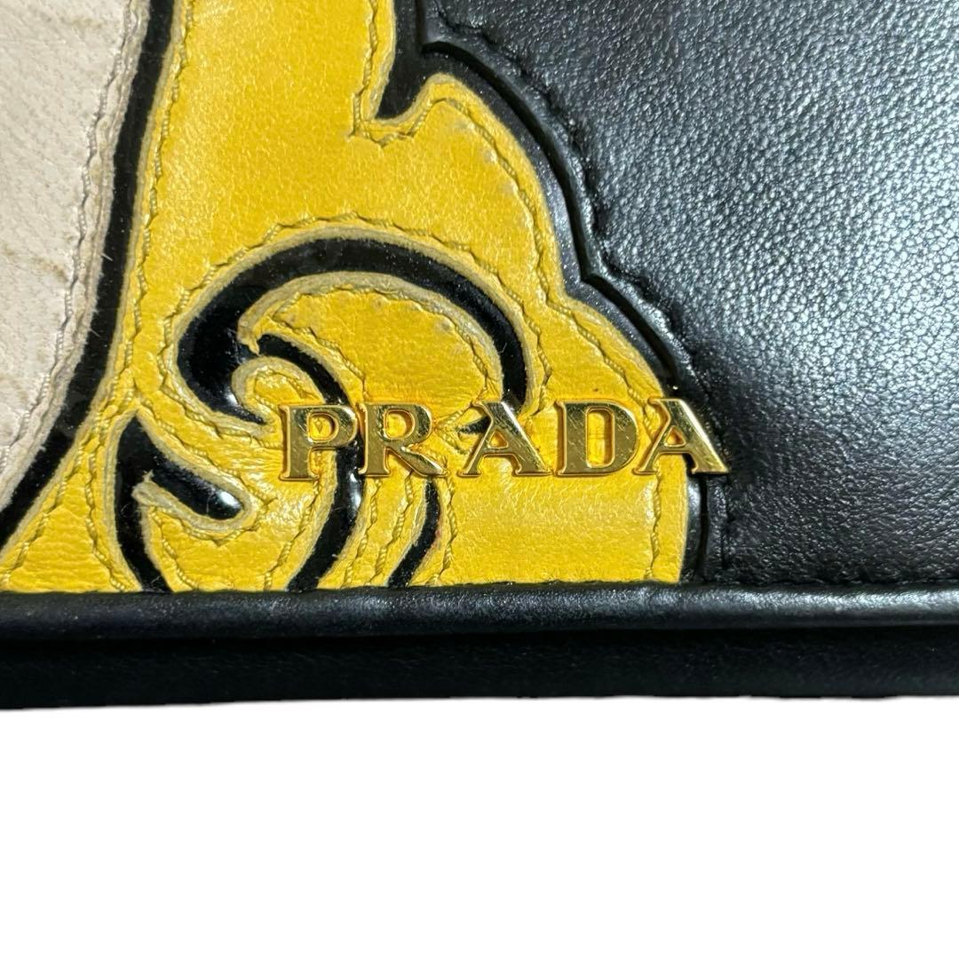 美品　希少　人気　プラダ　長財布　レザー　ブラック　アップリケ　顔　Wホック