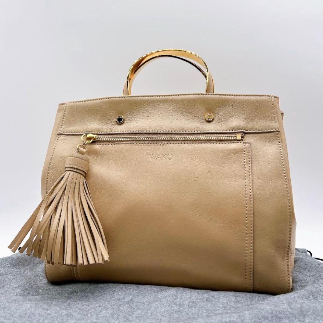 極美品WAKO ゴールドハンドル ハンドバッグ タッセル レザー f557
