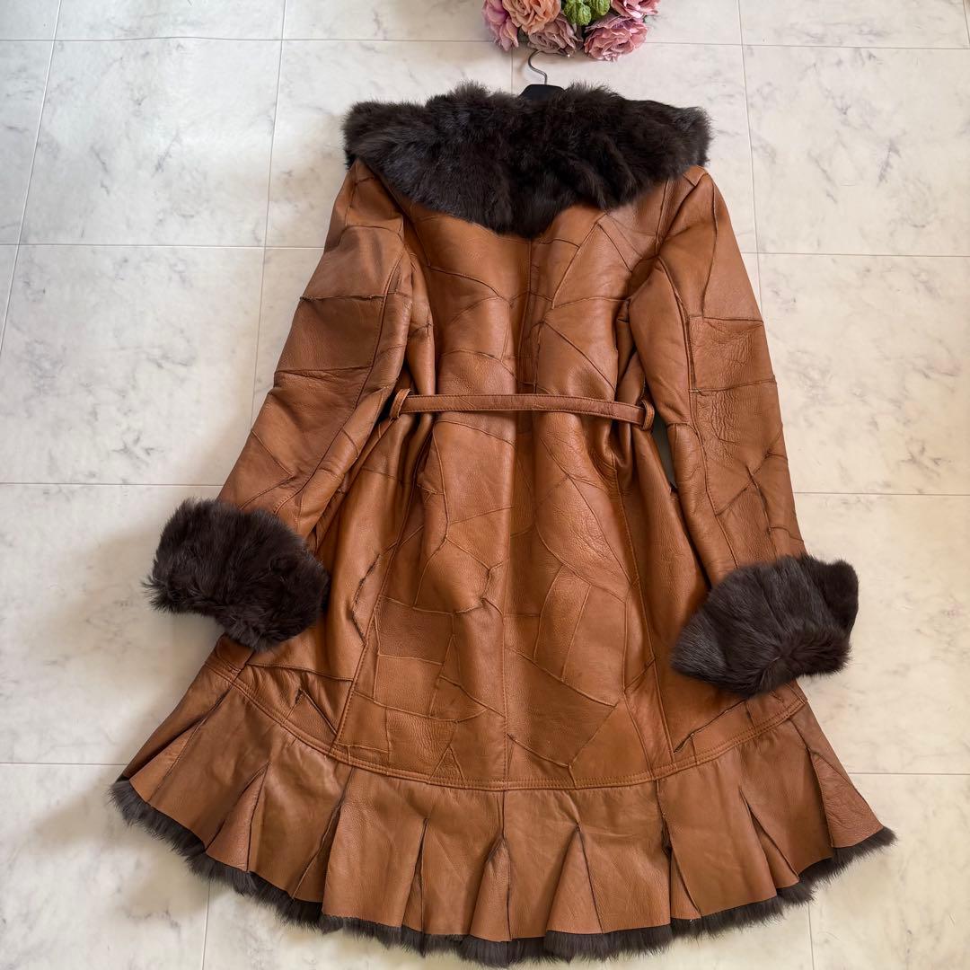 美品★ラビットファー 毛皮 羊革 女優襟 ロングベルテッドコート フリル L