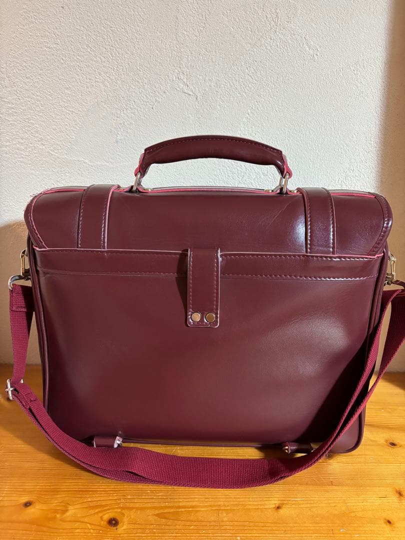 就実高校　通学バッグ　エンジ