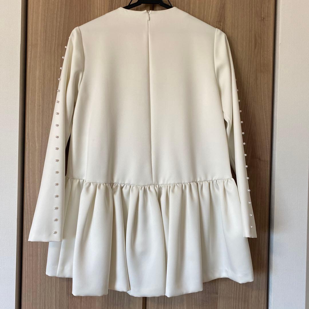 ツルバイマリコオイカワ　パール付きペプラムトップス