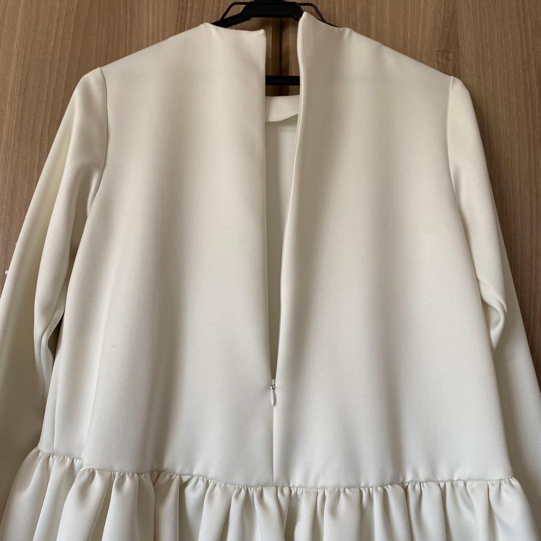 ツルバイマリコオイカワ　パール付きペプラムトップス