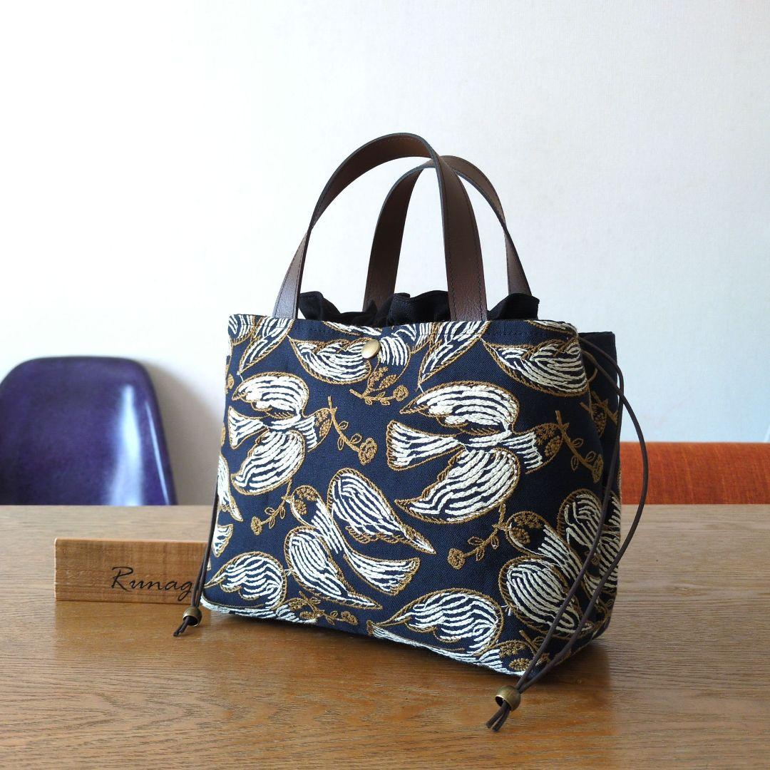 あおりポケットの巾着バッグ＊ミナペルホネン following day