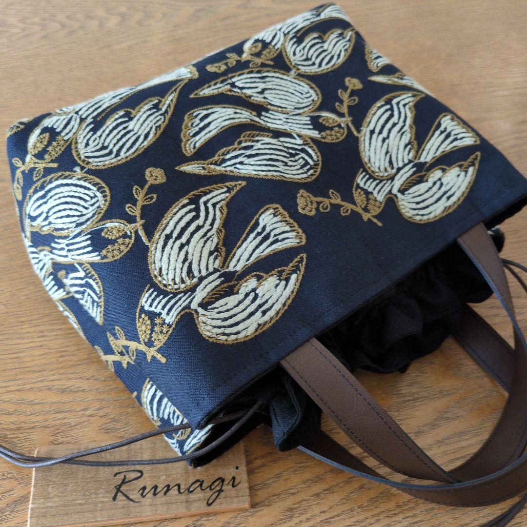 あおりポケットの巾着バッグ＊ミナペルホネン following day