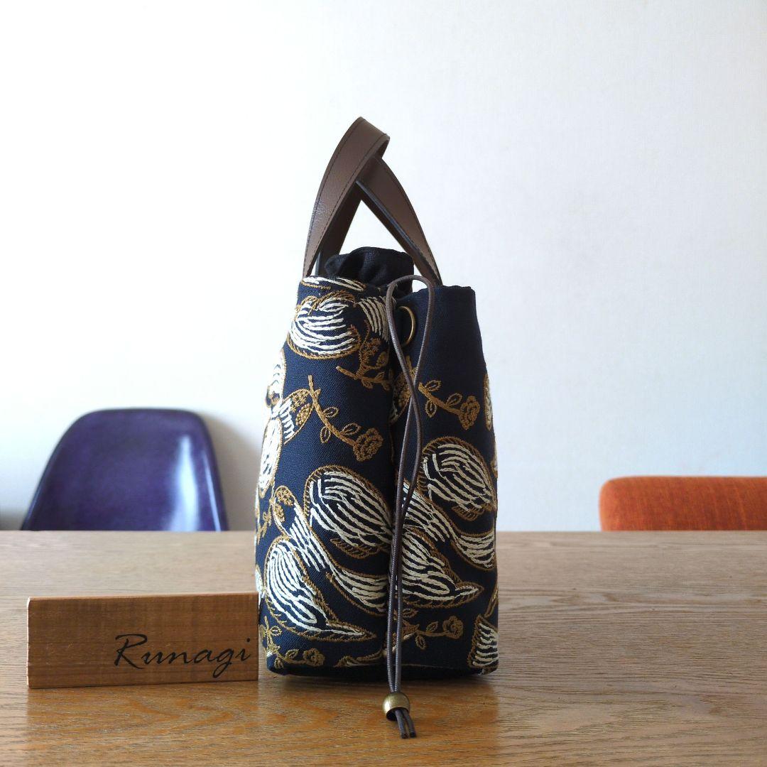 あおりポケットの巾着バッグ＊ミナペルホネン following day