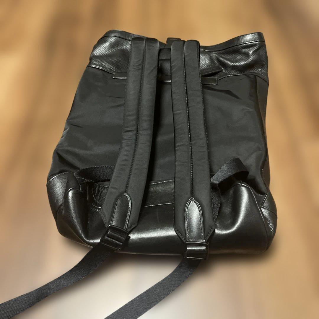 【としゆき】COACH ブラック ロールトップリュック