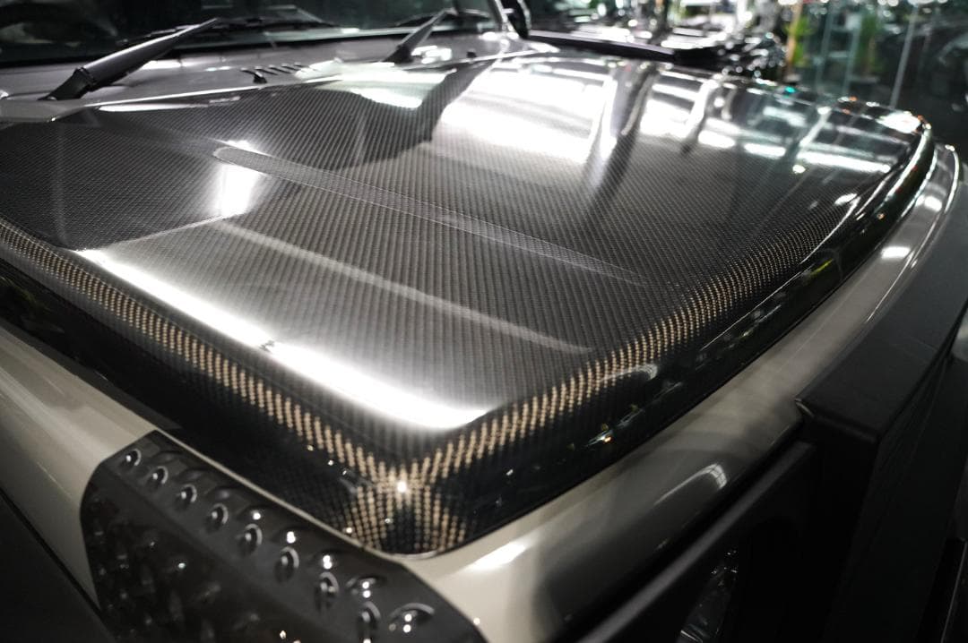 たにけんジムニーブラックカーボンボンネット　JB64　クリアー塗装品