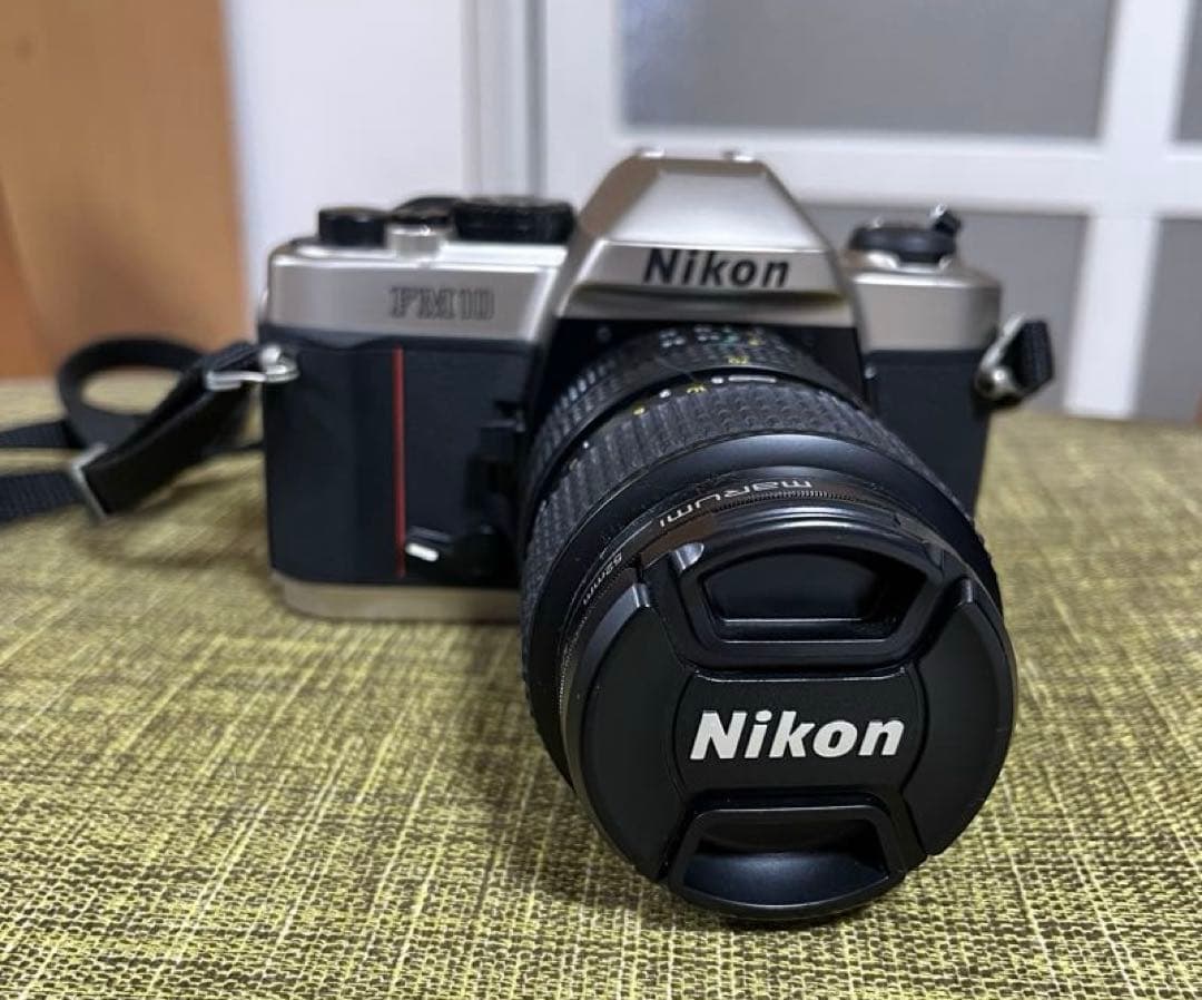 【Nikon FM10 】フィルムカメラ 35〜70㎜レンズ、専用ケース付き