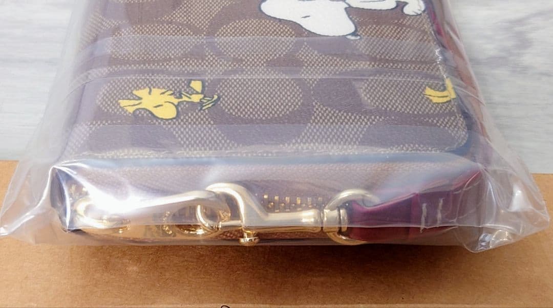 新品 COACH コーチ スヌーピー シグネチャー柄 ラウンドジップ 長財布