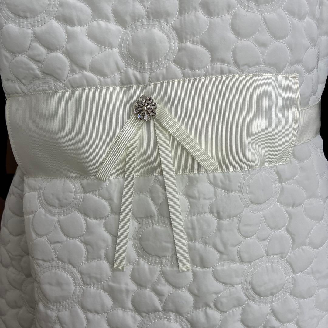 スーパービューティー☆44☆新品タグ付き　フード付きお花型キルティングロングジレ