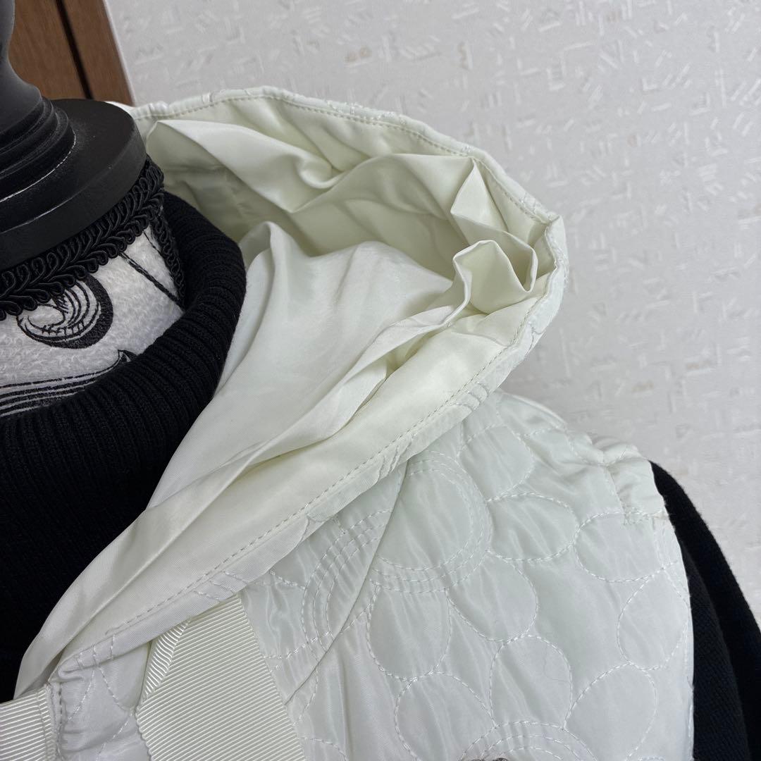 スーパービューティー☆44☆新品タグ付き　フード付きお花型キルティングロングジレ