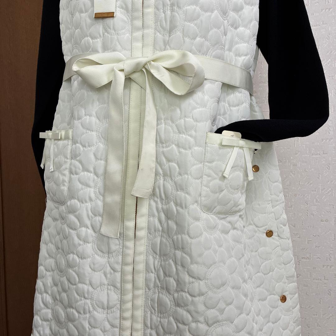 スーパービューティー☆44☆新品タグ付き　フード付きお花型キルティングロングジレ