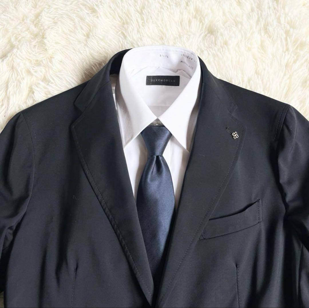 <美品>TAGLIATORE 新ロゴ reflect ネイビー ウールスーツ48