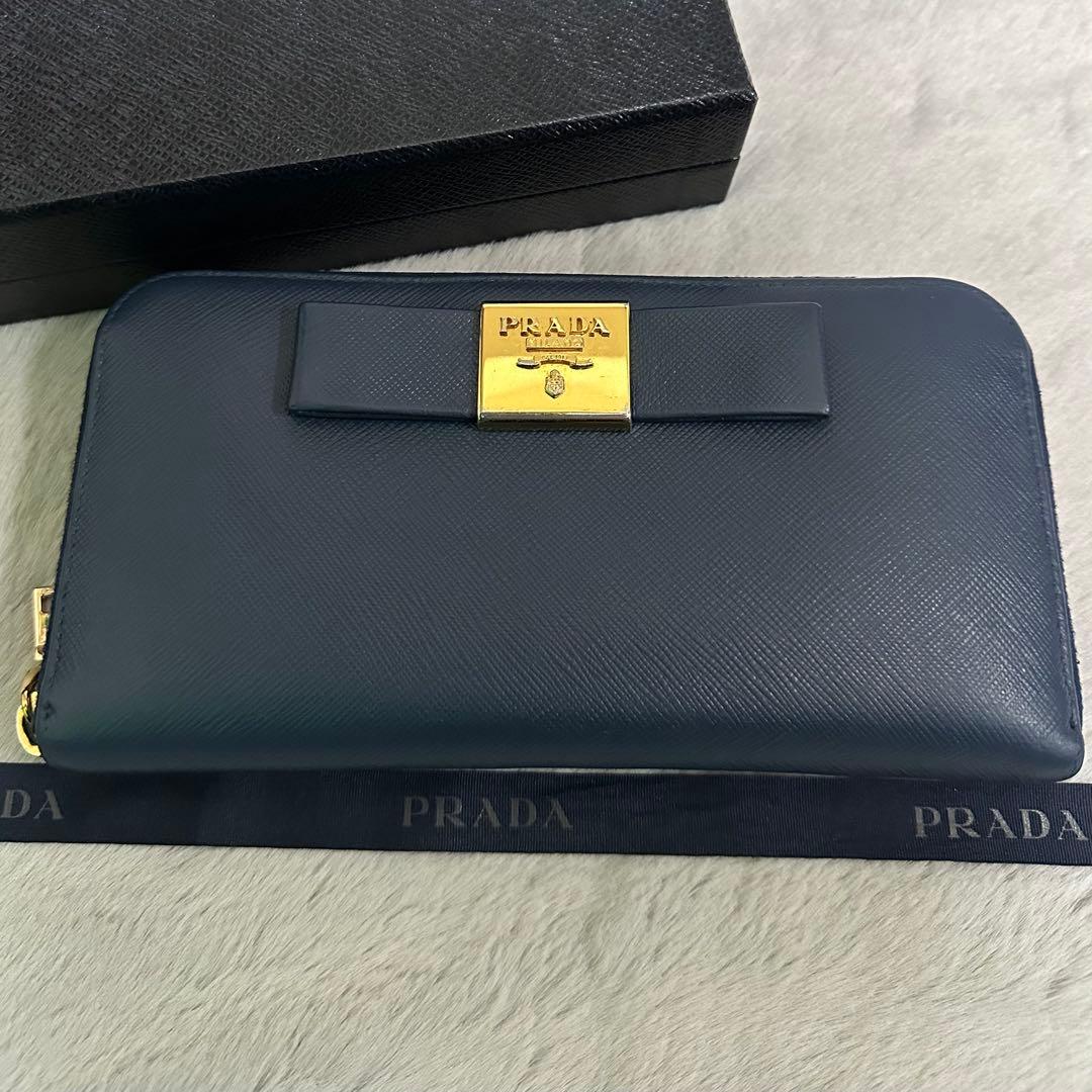 PRADA プラダ　長財布　ラウンドジップ　リボン　ブルー　ゴールドロゴ